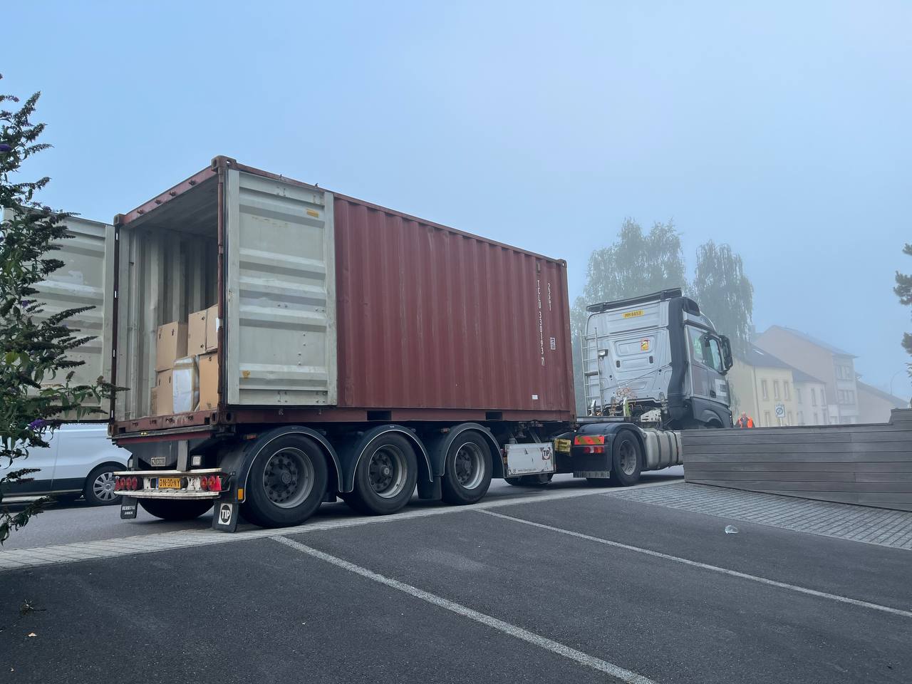 Delivery truck with a shipping container full of boxes